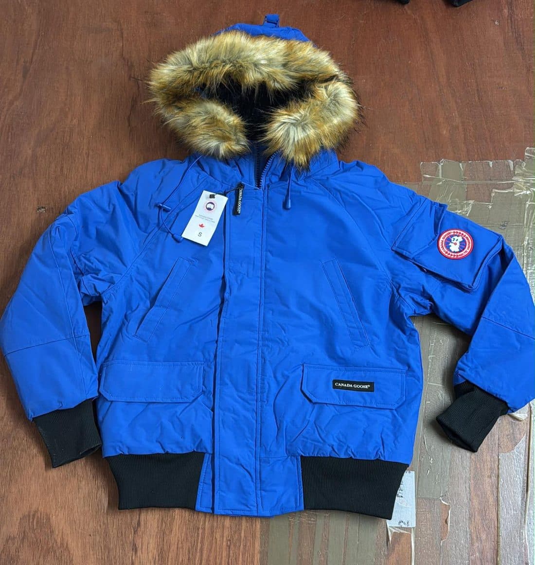 Canada Goose Fur Hood Bomber Jacket in Blue — front