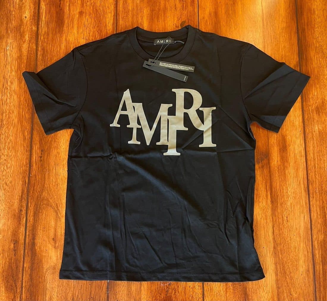 AMIRI Bold Wordmark Tee in Black — front