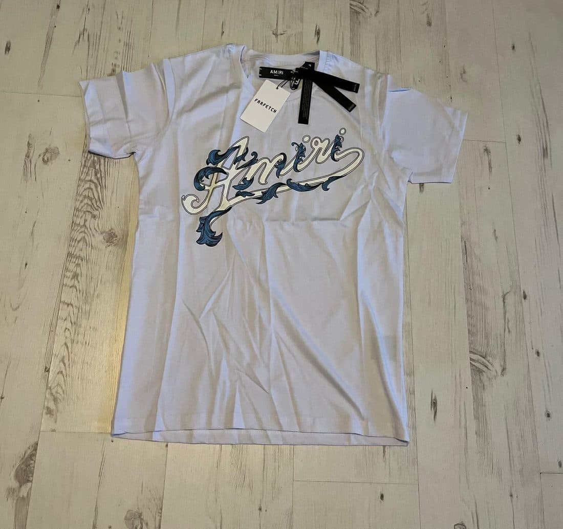 AMIRI Script Logo Tee in White — front