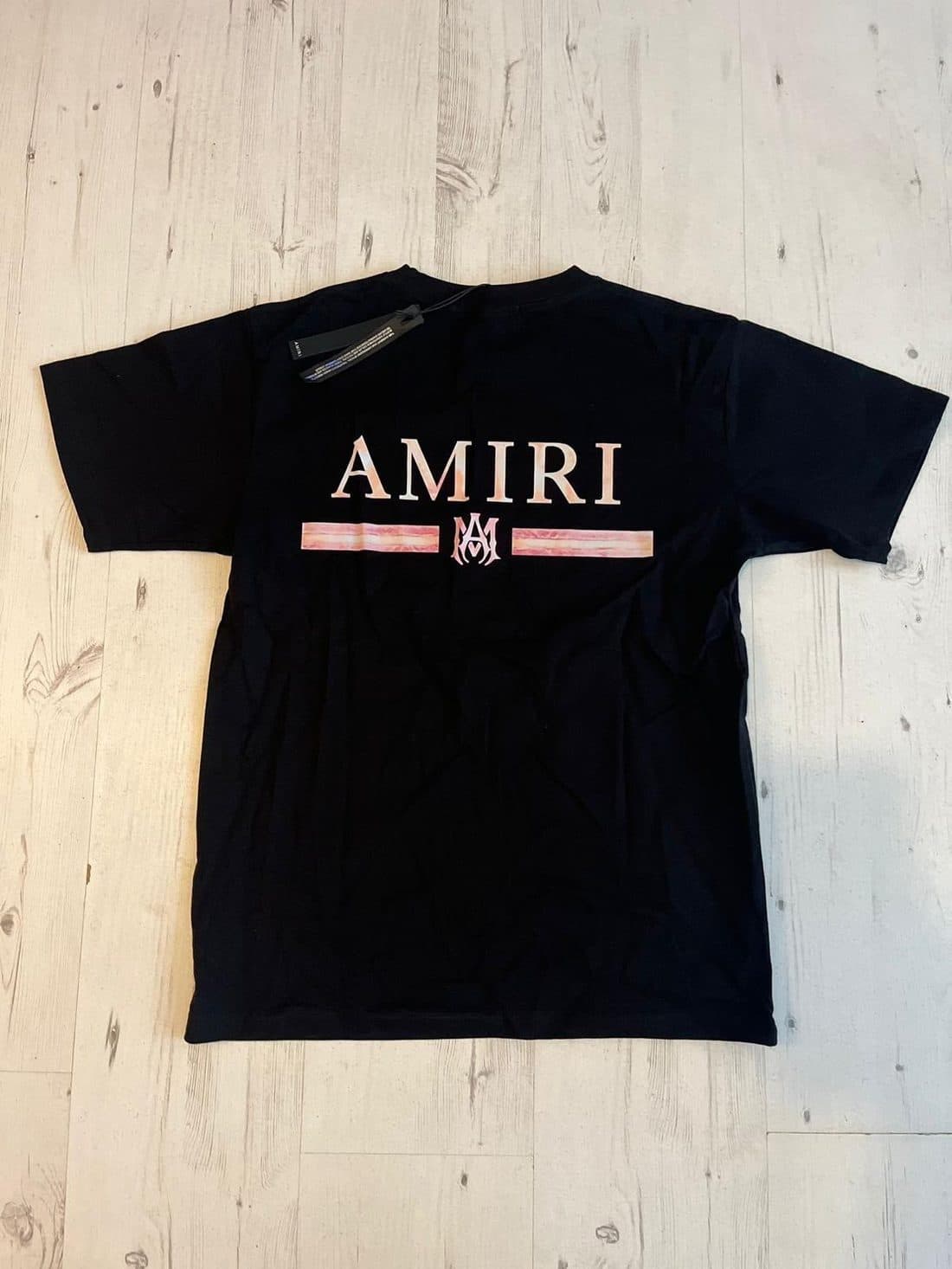 AMIRI Stripe Wordmark Tee in Black — front