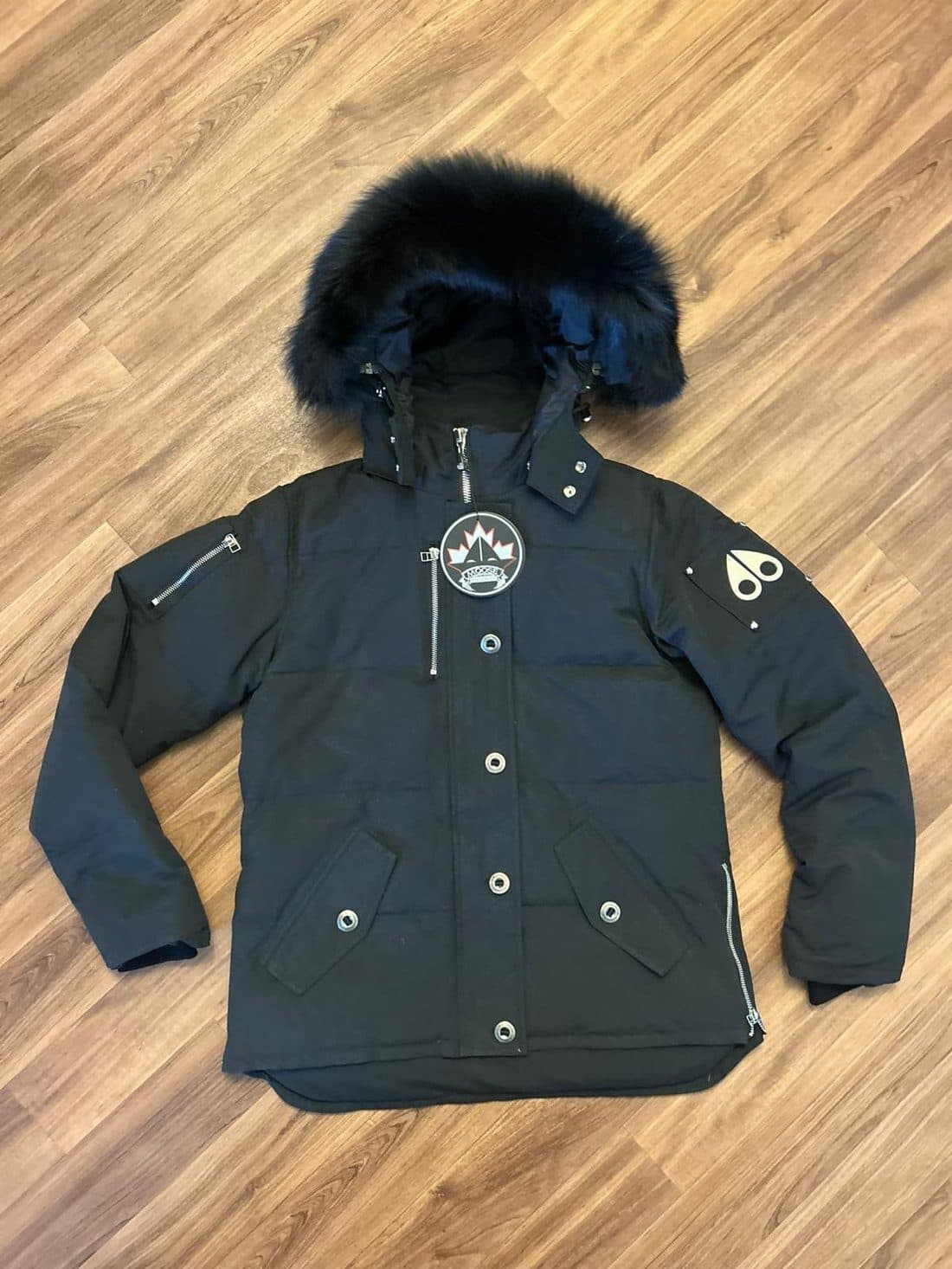 Moose Knuckles Fur Hood Parka in Black — front